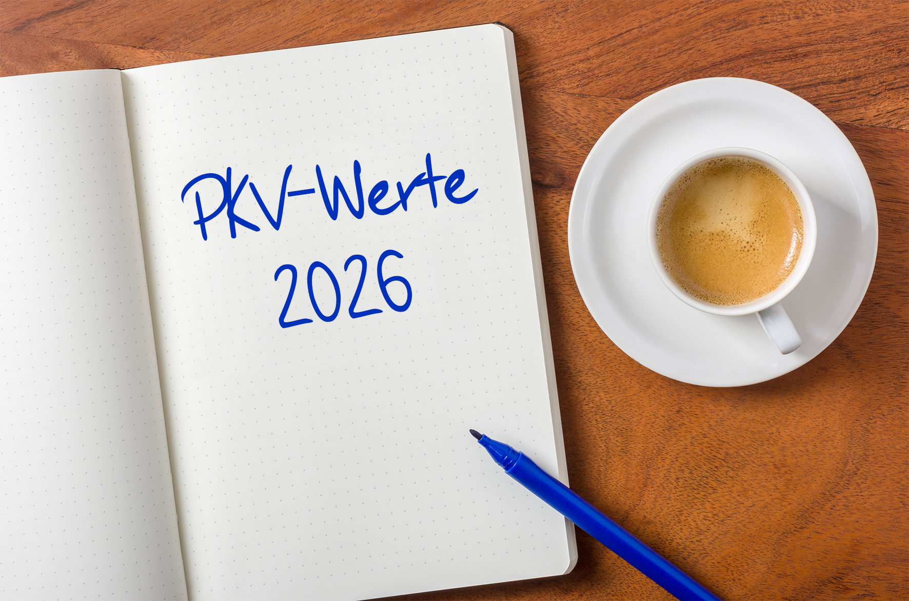 Geöffnetes Notizblöckchen mit handschriftlichem Text PKV-Werte 2026